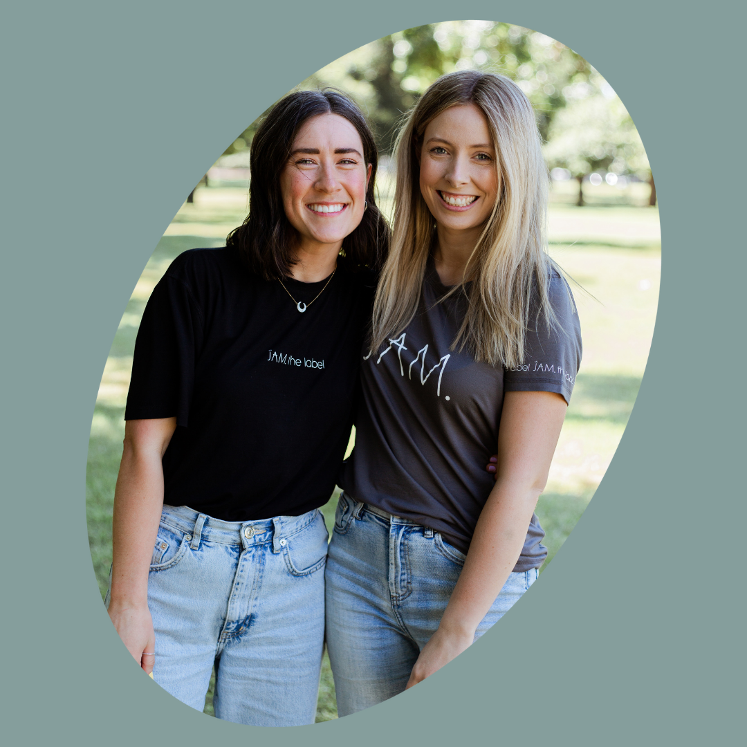 JAM's co-founders, Emma and Molly, standing in a park. There is a grey circular frame around the image. 